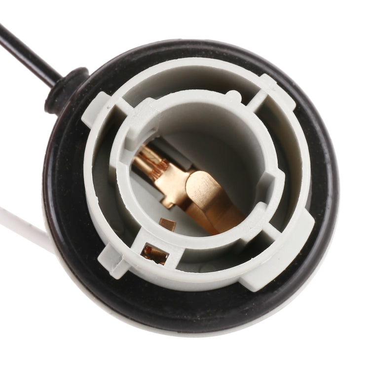 Reversing light holder socket close-up with copper terminals in black-and-white ring