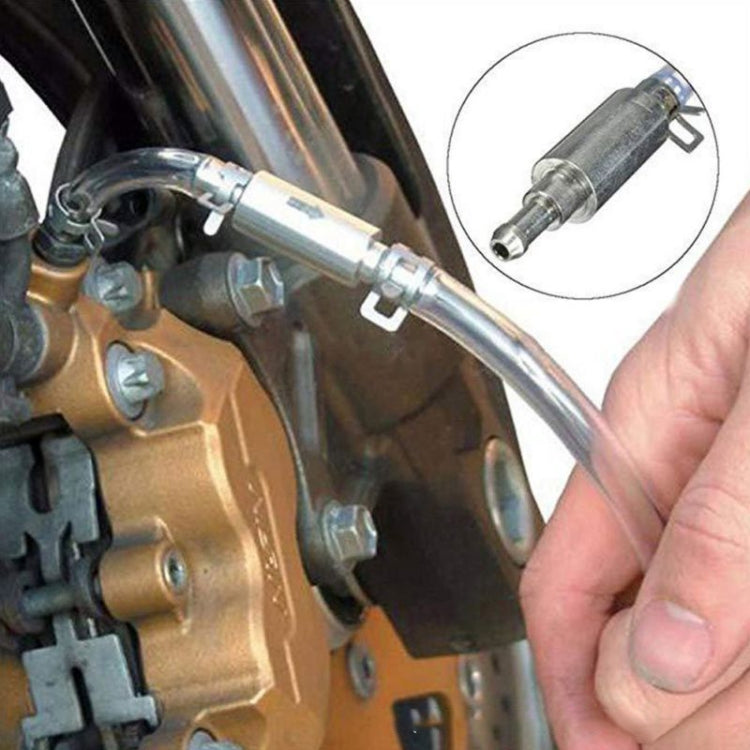 Motorcycle hydraulic brake bleeder adapter with clear tube connected to brake fitting