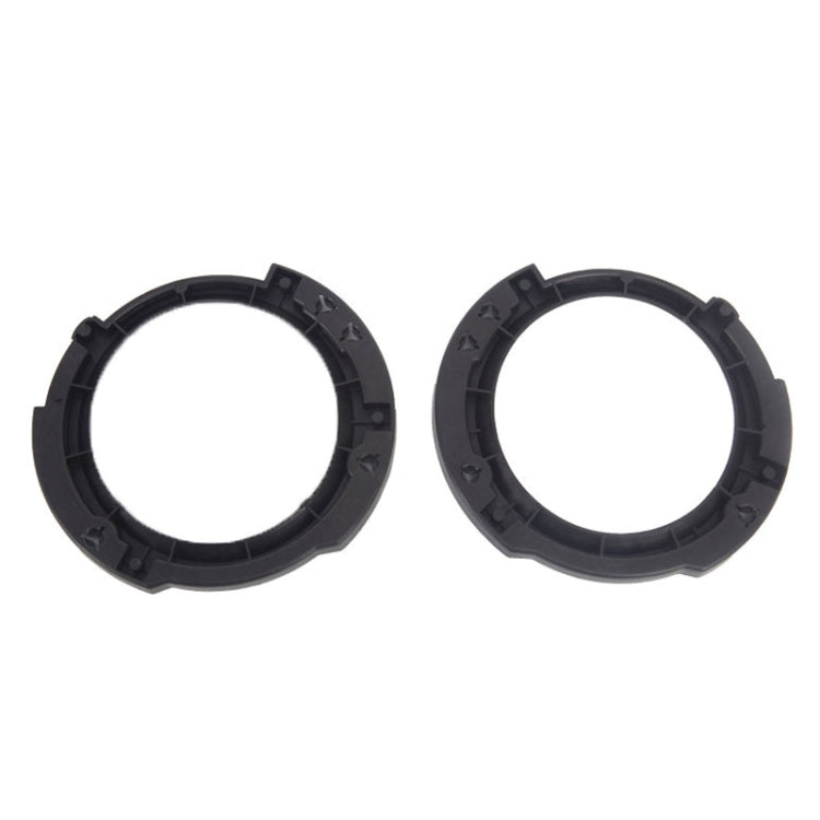 Set of two black plastic headlight inside brackets, circular ring with mounting tabs