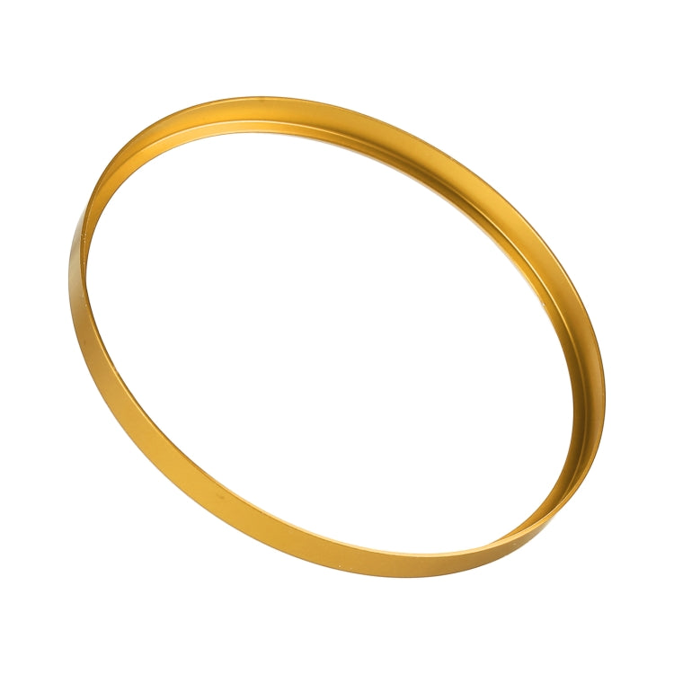 Car headlight switch decorative ring, gold circular band, angled view