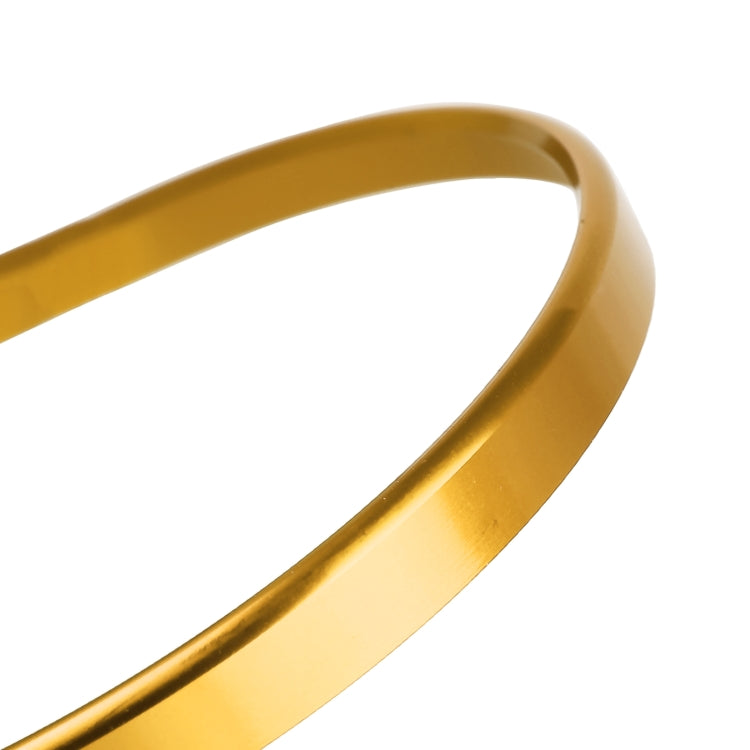 Car headlight switch decorative ring, gold metal edge close-up