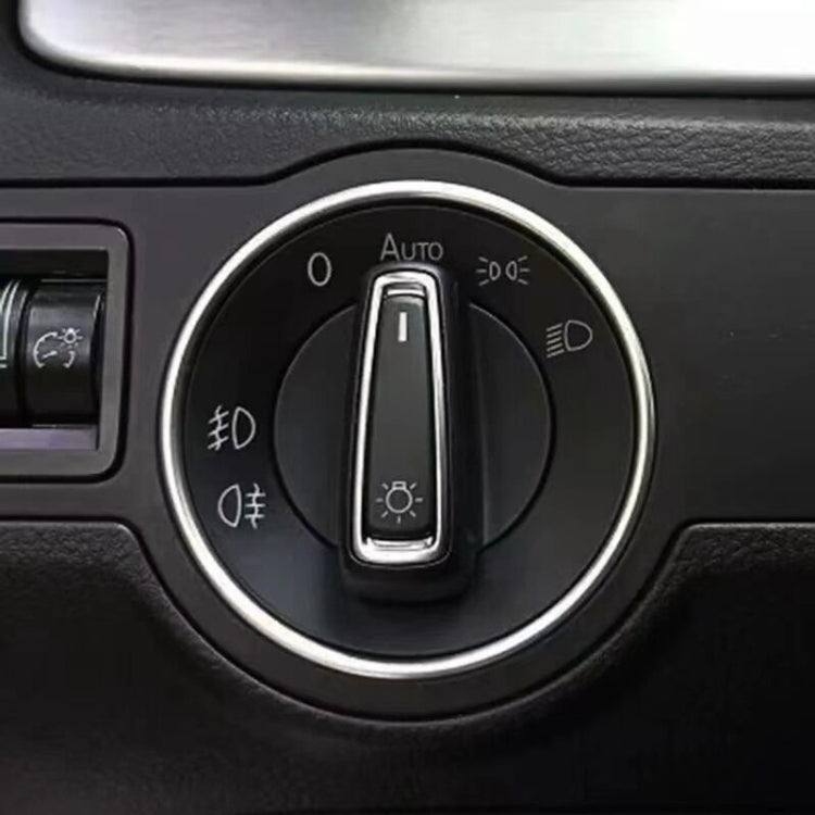 Car headlight switch decorative ring, silver outline around rotary light control