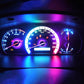 Car dashboard gauge cluster with blue and purple LED backlight glow