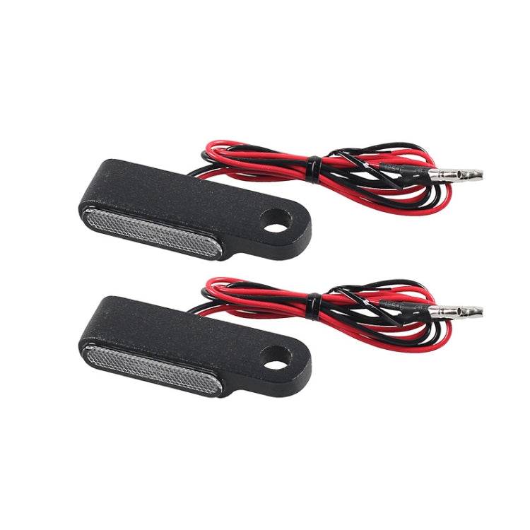 Set of two rectangular black LED turn signals with mounting holes and red wiring