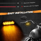 Motorcycle handlebar LED turn signal lights lit yellow with wiring harness visible