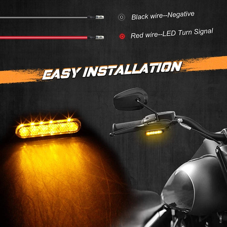 Motorcycle handlebar LED turn signal lights lit yellow with wiring harness visible