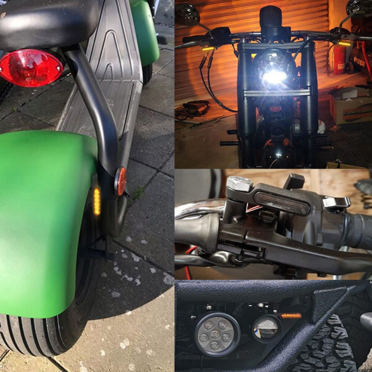 Flashing LED turn signal light on motorcycle front fairing with amber glow