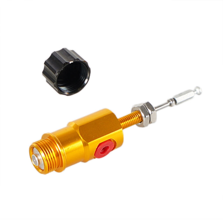 Gold hydraulic master cylinder rod with red button, silver clevis rod, and black cap
