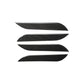 Set of four carbon fiber-look outside door handle decorative stickers, chevron shapes.
