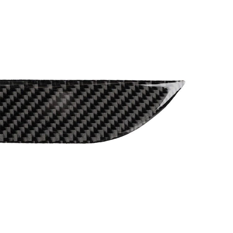 Close-up carbon fiber-look outside handle sticker with dark woven texture and curved edge.