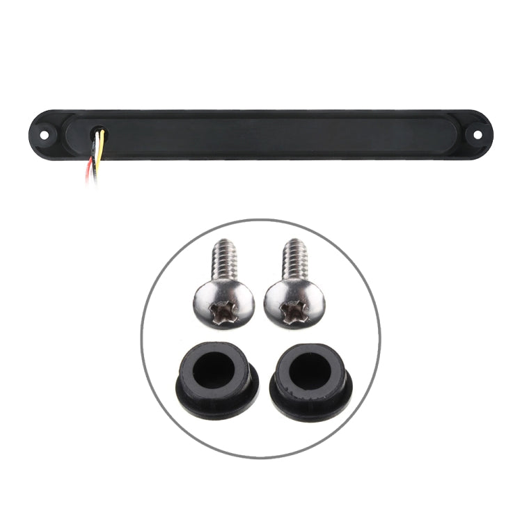 Black LED tail light bar with two mounting holes, wires, and included mounting screws and grommets.