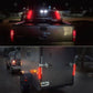 Rear-mounted LED tail light bar glowing red brake and amber turn signals on vehicle.