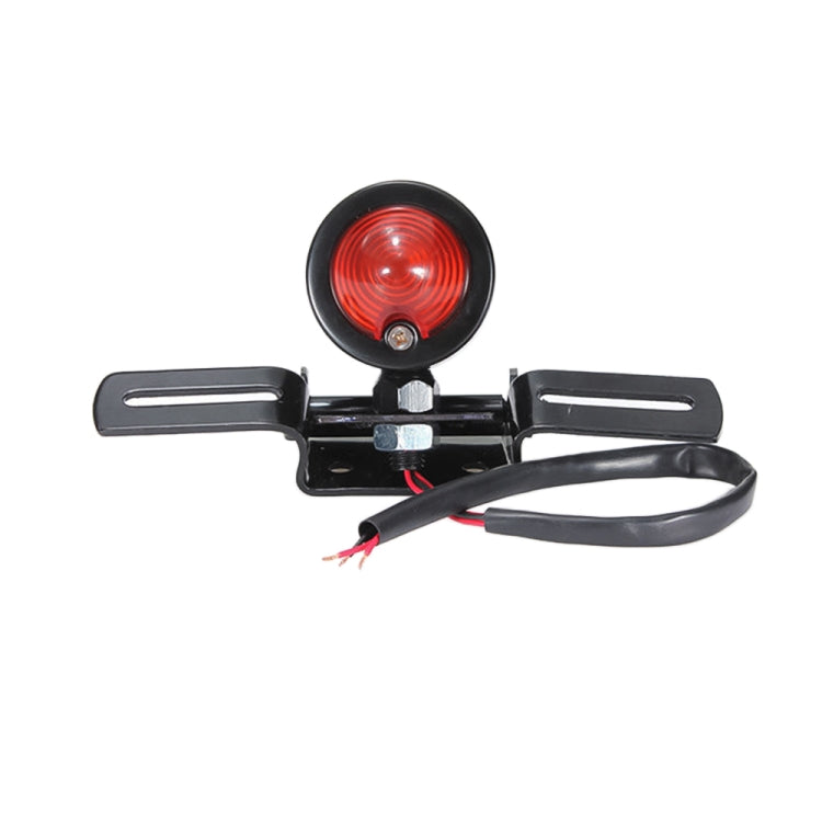 Round red brake light on black bracket with two side mounting plates and wiring