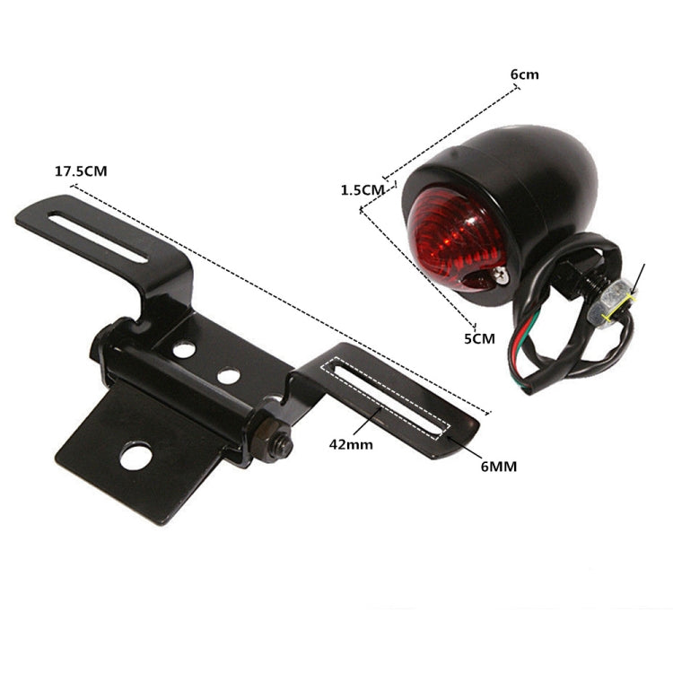 Black brake light with red round lens and dimension labels for mounting bracket