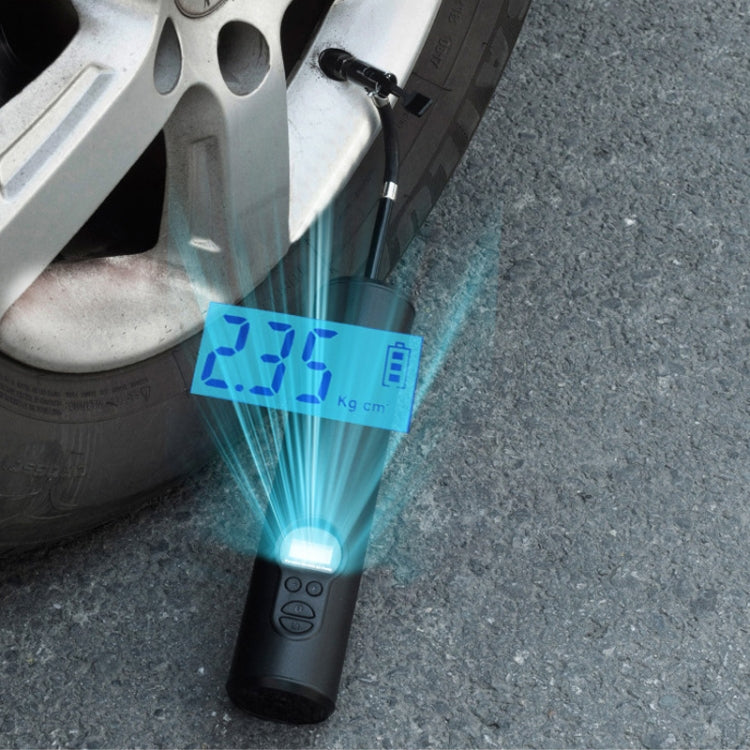 Rechargeable portable air pump with lit LCD screen and bright COB light by a tire