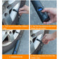 Hand holding rechargeable air pump with LCD display and nozzle attached to a tire valve