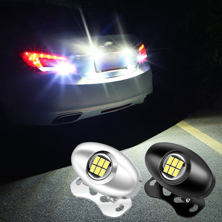 Pair of LED reversing lights (black and silver) with bright white lens glow
