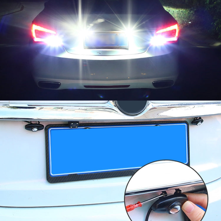 LED reversing light being installed on car trunk, black light housing visible