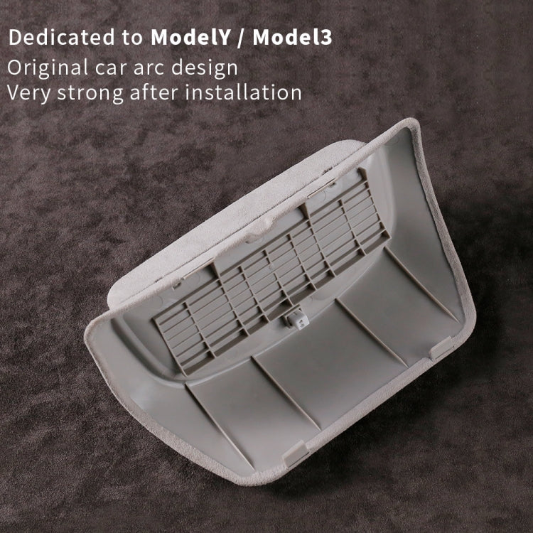 Car overhead glasses storage box, underside view with vented grille and clips