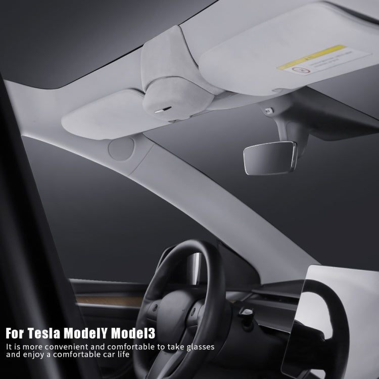 Car overhead glasses storage box in light gray, mounted near headliner