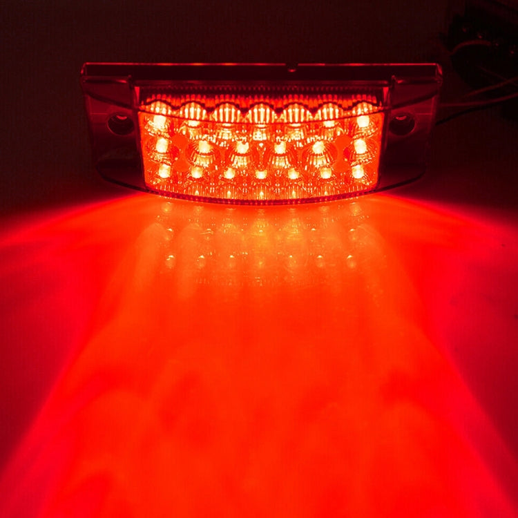 Lit red LED tail light showing bright edge panel illumination