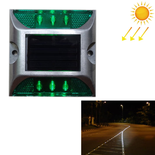 Green solar road stud light with glowing LEDs and built-in solar panel, square housing