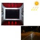 Solar LED road stud light with red flashing lenses and black solar panel window
