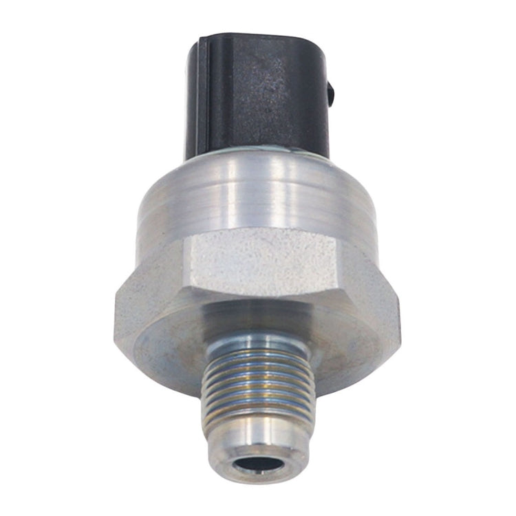 Car brake pressure sensor, front view with silver hex base and threaded outlet