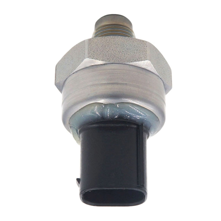 Car brake pressure sensor, front/angled view with black sensor opening and threaded top