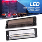 Black LED side marker/brake light with red illumination across slim lens
