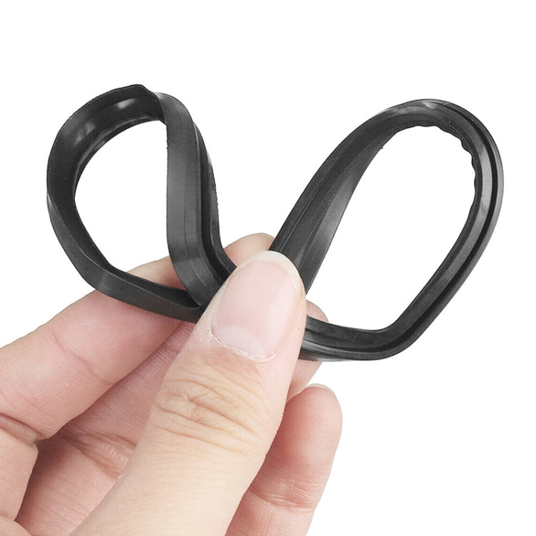 Hand holding black rubber sealing ring for car roof antenna
