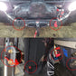 Pair of mounted 20mm battery binding posts with red insulators and black boots
