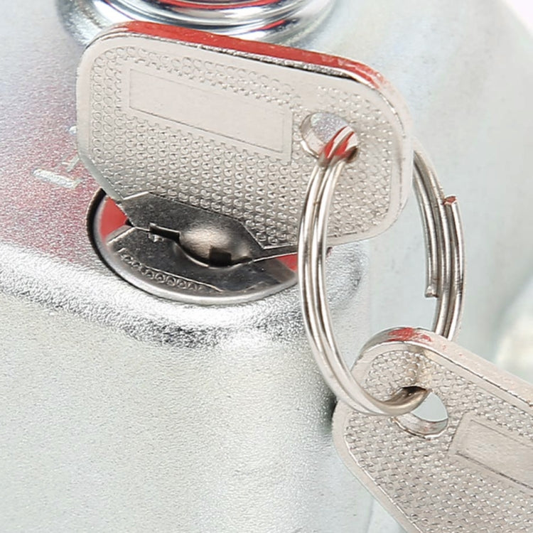 Metal battery cut-off switch key and keyring on textured silver housing