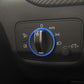 Blue trim ring sticker around car headlight control knob