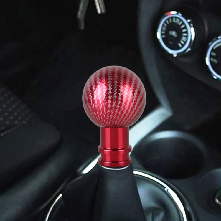 Car gear shift knob with red carbon fiber textured ball top and red metal base