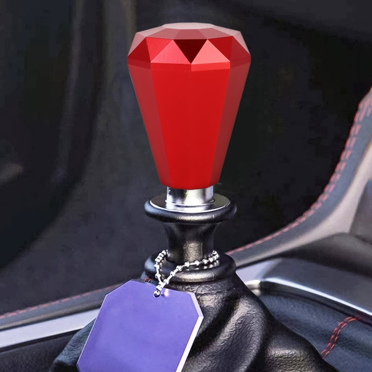 Red diamond-cut metal gear shift knob with chrome base and black leather boot