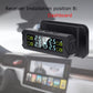 Solar TPMS receiver mounted on dashboard, black unit with digital tire pressure screen