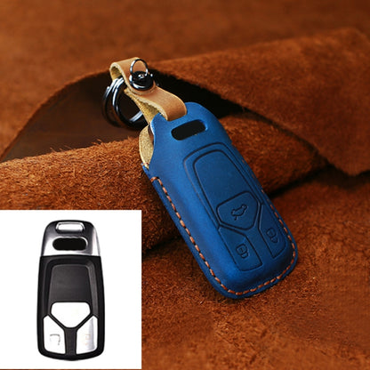 Blue leather key fob protective cover with key ring, stitched edges, and button cutouts