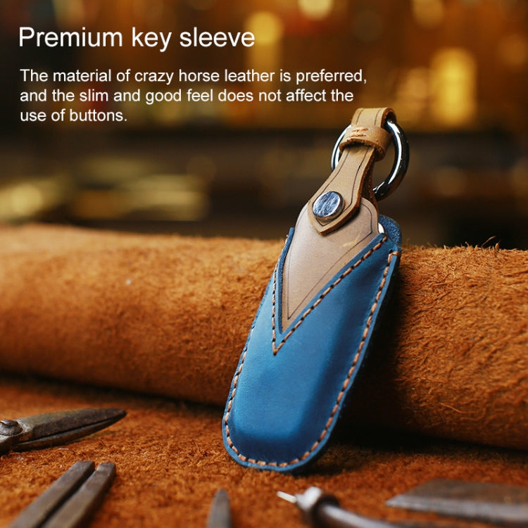 Blue leather key sleeve with tan top loop, key ring, and contrast stitching