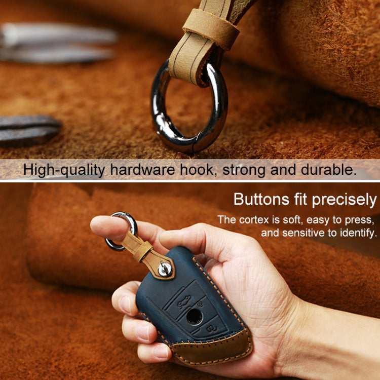 Blue leather key cover with metal keyring hook and stitched leather edges