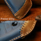 Blue leather key cover close-up with stitching and cutout for key fob button