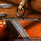 Leather key cover close-up with metal ring and blue-stitched side edge panel