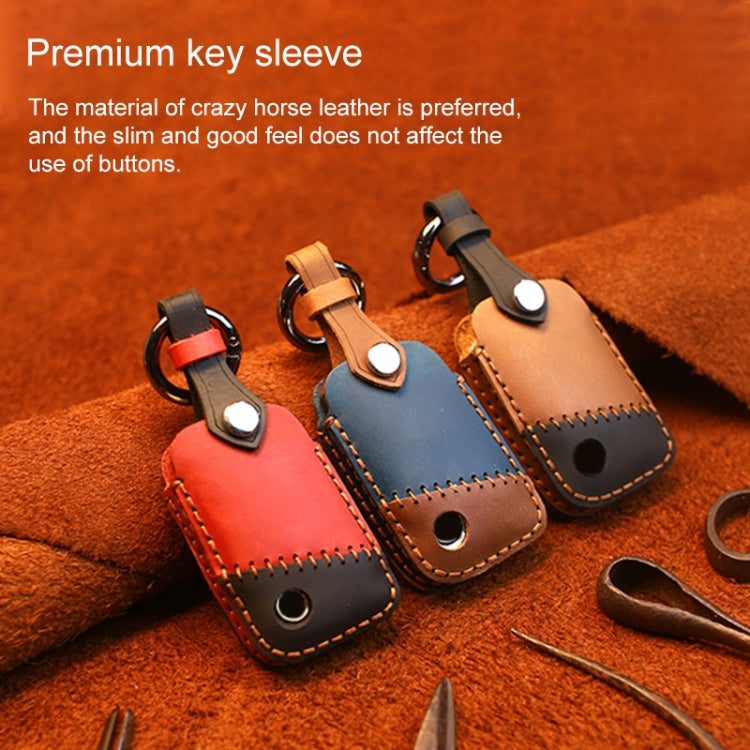 Set of leather key covers in red, brown, and blue with metal rings and stitch detailing