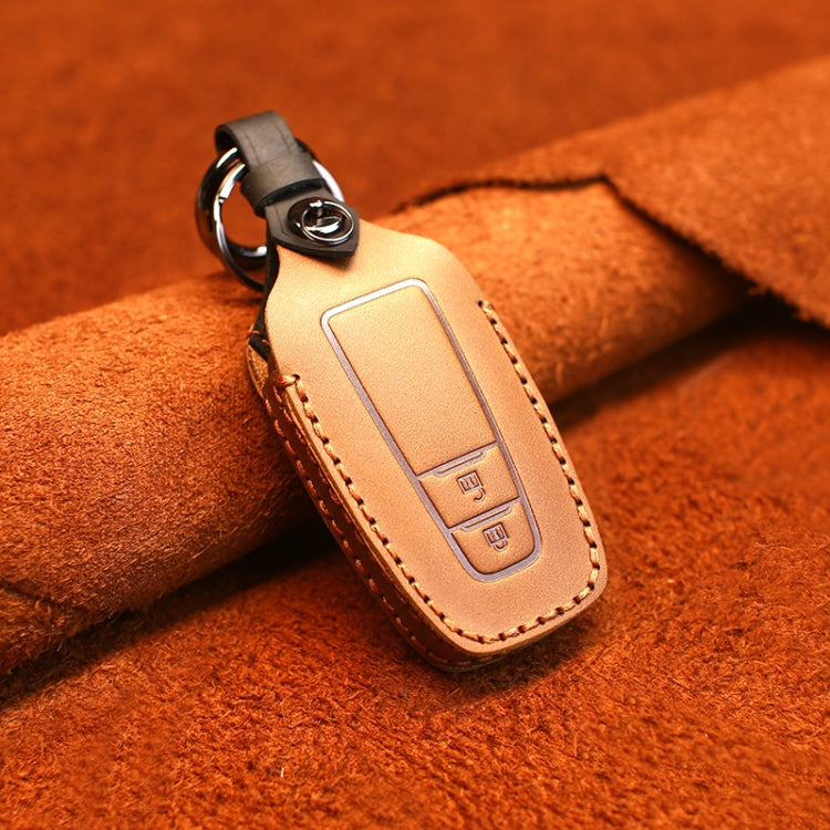 Leather key protective cover with two-button fob insert, tan/brown, stitched edges.