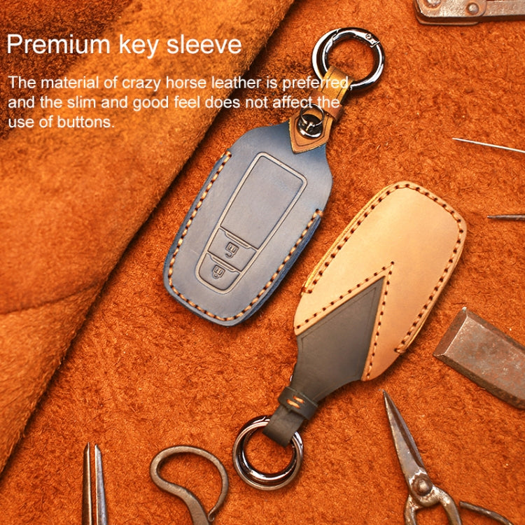 Leather key sleeves set in tan and dark blue, each with keyring loop.