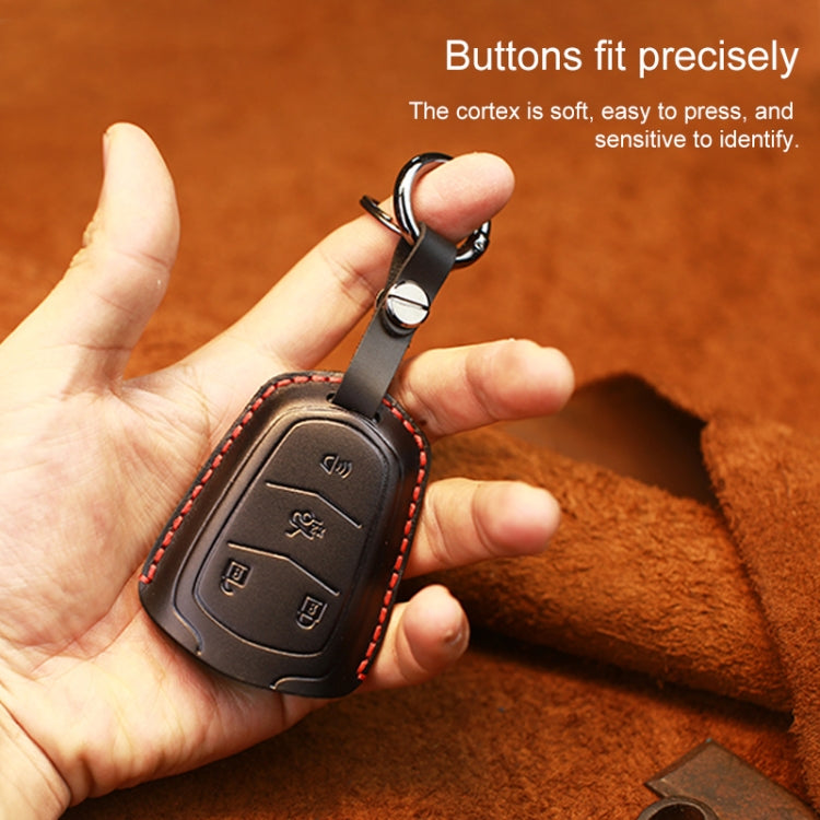 Black leather key fob cover with key ring, embossed buttons and red stitching