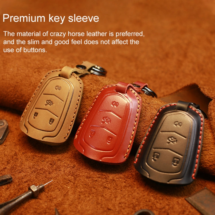 Leather key fob covers in tan, brown, black, and red with key ring loops
