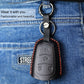 Black leather key fob cover with key ring attached to denim belt loop
