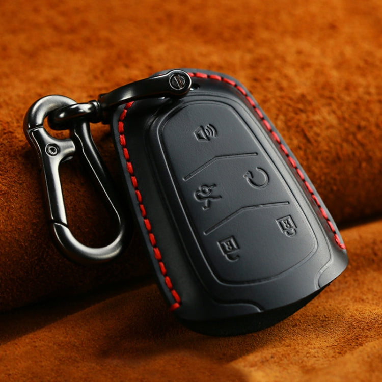 Black leather key fob cover with red contrast stitching and keyring hook