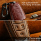 Red leather key fob cover with keychain hook, red stitching, carved button icons